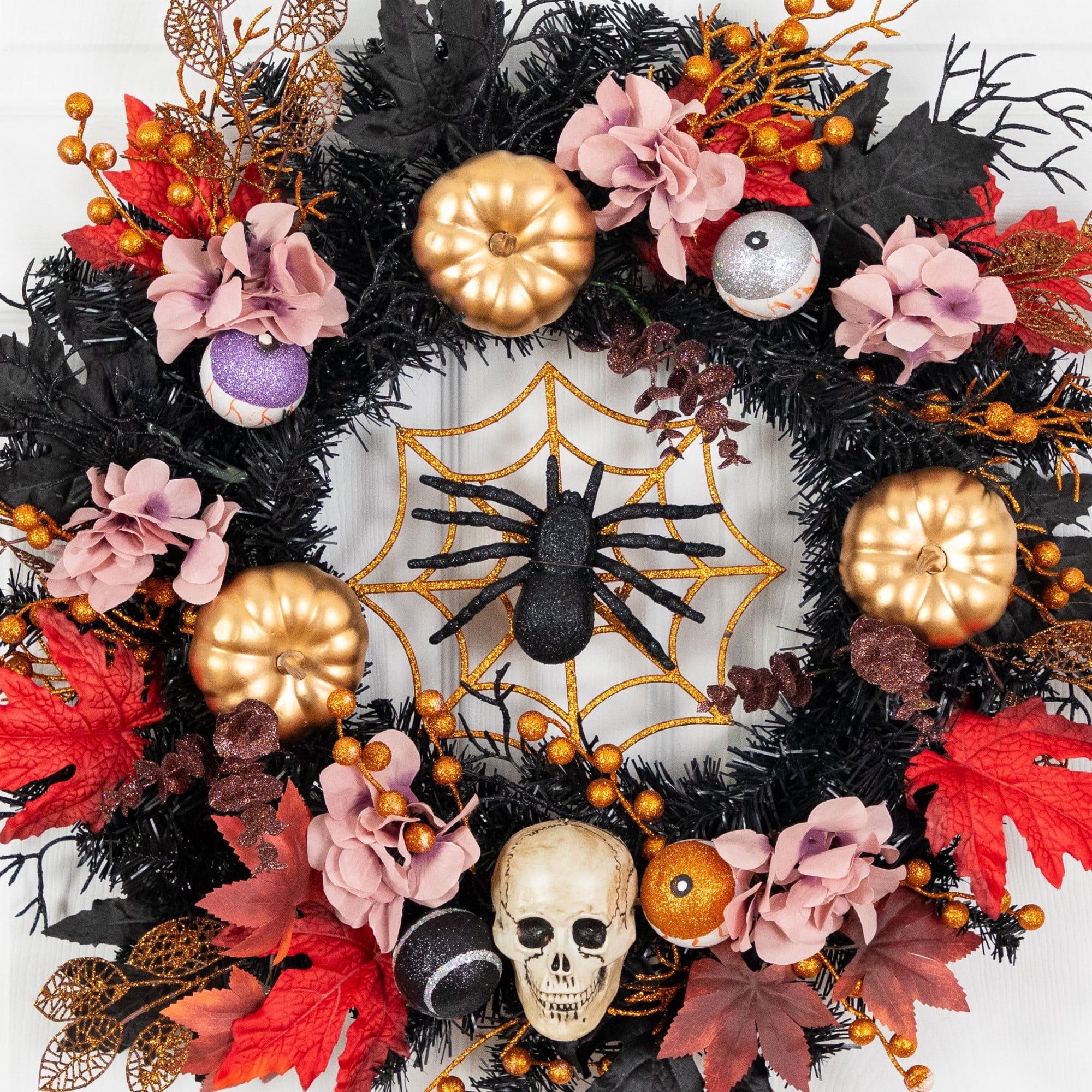 24in. Artificial Halloween Wreath with Skulls, Spiders and Pumpkins