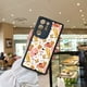 thumbnail image 2 of Añade un toque de diversión a tu iPhone con una funda protectora única y protectora con gráficos de dibujos animados., 2 of 4