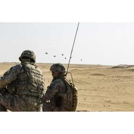 UH-60 Black Hawk helicopters prepare to airdrop soldiers in Kuwait Canvas Art - Stocktrek Images (34 x 23)