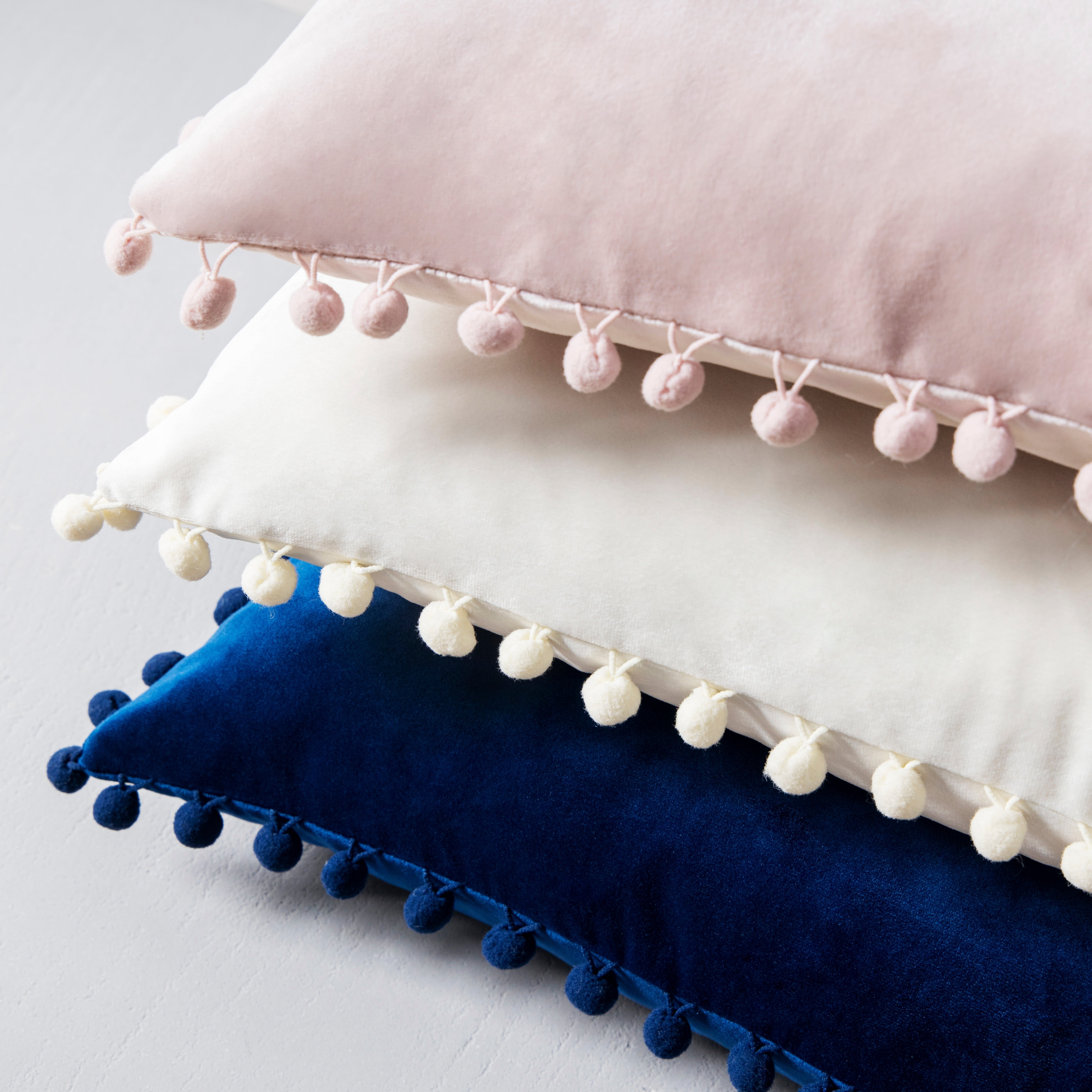 Phantoscope Light Pink Throw Pillow Covers 2 Pack, 12" x 20" Velvet Decorative Pillow Cases with Pom Poms, Soft Square Cushion Covers for Couch Sofa Bed