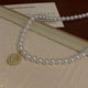 thumbnail image 4 of Collar de perlas de ojo de gato estilo retro francés para mujer, cadena de clavícula de lujo ligera y de alta gama, 4 of 5