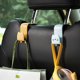 thumbnail image 2 of Gancho para respaldo de asiento de 4 Uds., almacenamiento multifunción Universal para asiento trasero de coche Invisible, gancho pequeño bonito, gancho de almacenamiento, 2 of 5