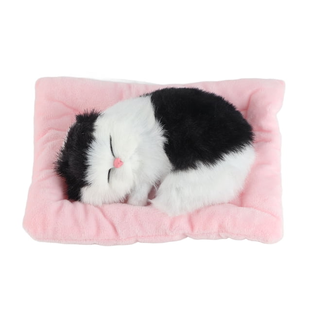 Juguete interactivo para mascotas con sonido, forma de gato blanco y negro, con forma de gato durmiendo sobre una almohadilla.