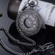 thumbnail image 4 of Reloj de bolsillo vintage de cuarzo negro con números romanos y cadena, 4 of 5