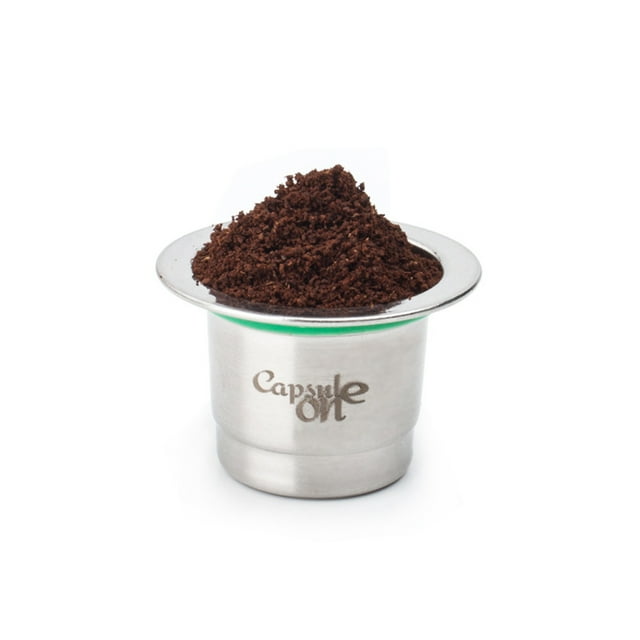 Two Usages Stainless Steel Fillable Coffee Capsules Reusable Coffee Capsule Cup Filter compatible with Nespresso coffee machines. The image shows a silver stainless steel coffee capsule filled with ground coffee, featuring a precise filter design. The capsule is reusable, corrosion-resistant, and environmentally friendly, designed to enhance coffee flavor. Compatible with most Nespresso coffee machines except U models and some Scishare machines.