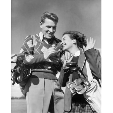 Low angle view of a young couple with golf clubs Poster