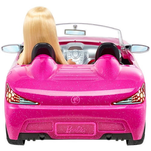 barbie doll and pink convertible