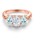thumbnail image 3 of Gem Stone King 18K Rose Gold Plated Silver White Moissanite and Sky Blue Topaz Filigree Style 3 Stone Ring for Women (2.50 Cttw, Oval 8X6MM and 6X4MM) (Size 5), 3 of 6