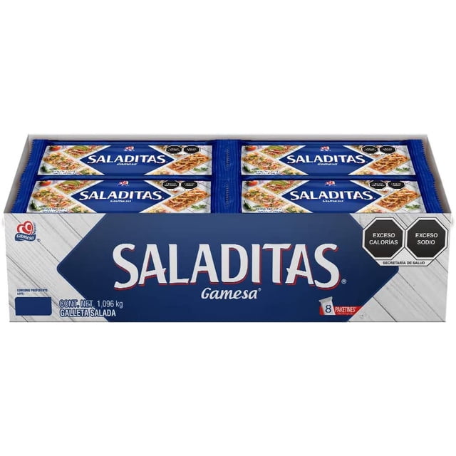 saladitas galletas gamesa, sabor salado, 8 paquetes de 137 gramos. 1096 gramos caja con ocho paquetes individuales azules, texto SALADITAS grande y logotipo Gamesa, imagen de galletas saladas en el empaque y etiquetas frontales visibles 'EXCESO CALORÍAS' y 'EXCESO SODIO'.