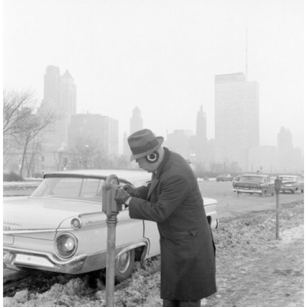 Man putting coins in parking meter Poster Print Item