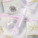 thumbnail image 3 of Papel de regalo con purpurina holográfica rosa Burymento, 43 cm x 10 m, 3 of 6