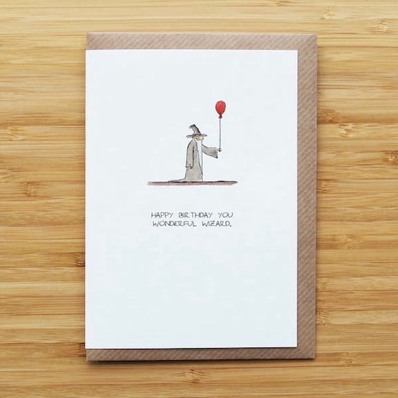 Whimsical birthday card featuring a wizard and red balloon for friends and family, perfect for celebrating any age.