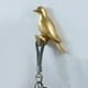 thumbnail image 1 of Gancho decorativo para pájaros, colgador de almacenamiento de ropa, moderno, portátil, creativo, para colgar animales, para toallas, ropa, comedor, M oro, 1 of 8