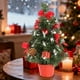 thumbnail image 4 of Mini árbol de Navidad artificial de 30 cm | Decoración retráctil para escritorio | Predecorado con adornos, piñas y lazos | Plateado, dorado, rojo y azul | Adorno de mesa para oficina o para fiestas, 4 of 6