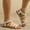 White, variant on KIJBLAE Women's Plus Size Roman Wraparound Strap Sandals, Soft Sole Slimming Design, Breathable Comfortable Beach Summer Daily Shoes Khaki 36