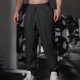 thumbnail image 1 of Pantalones largos para hombre, de color liso, informales, a la moda, ventilados, holgados, para hacer ejercicio, de poliéster., 1 of 7