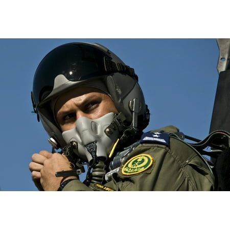 Air Force Pilot Flight Helmet A Saudi Air Force pilot adjusts his flight helmet before a mission Canvas Art - Stocktrek Images (35 x 23) ()