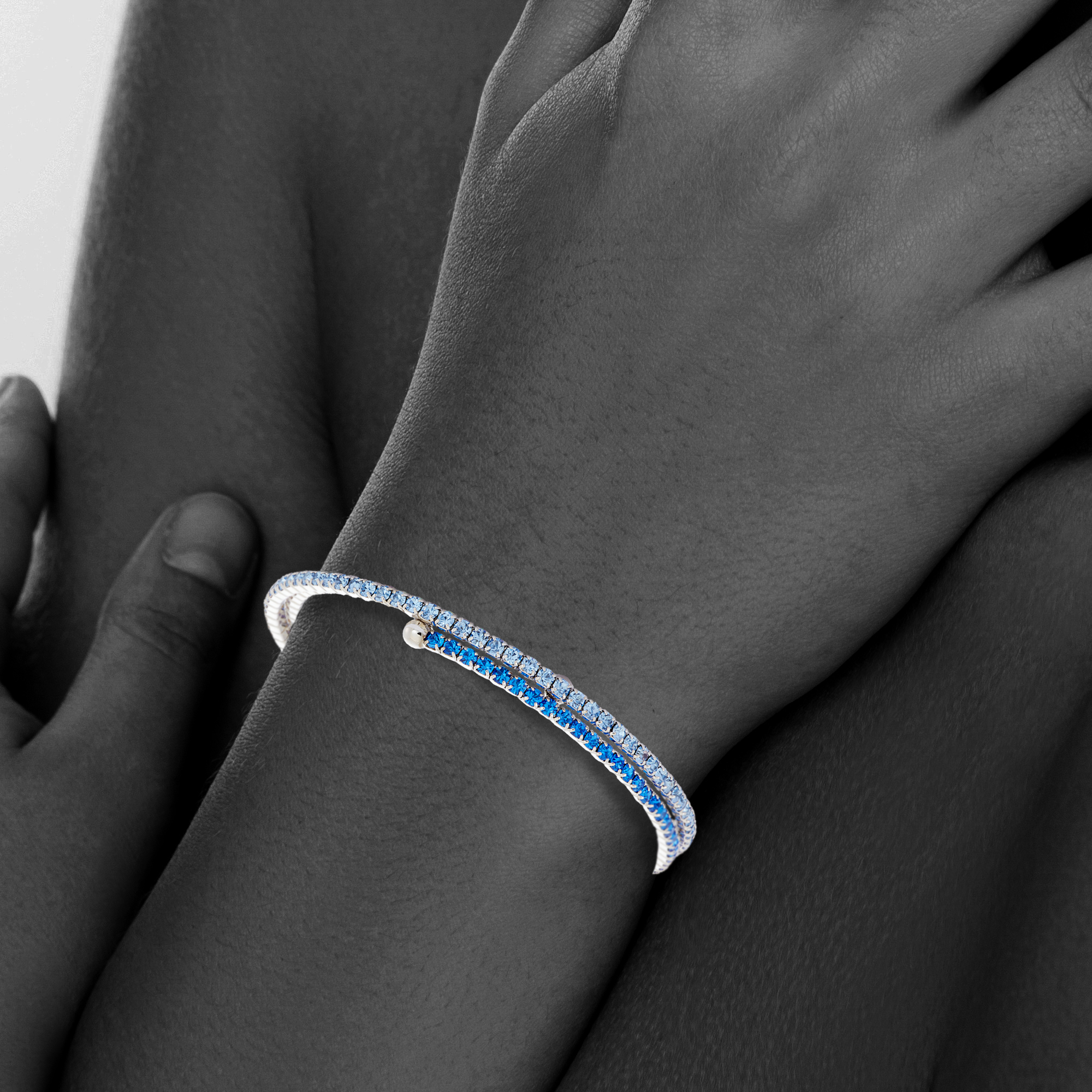 X & O Women's Double Row Silver Plated Flex Bangle with Sapphire and Aurora Crystals