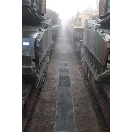 LAMINATED POSTER U.S. Army M1A2 Abrams tanks and M88A2 Hercules recovery vehicles arrive at a train station in Parsbe Poster Print 24 x