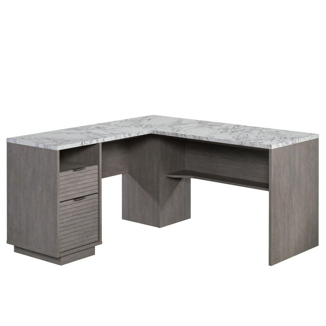 Sauder East Rock L-shaped desk in ashen oak with a marble-patterned surface, including two drawers and an open shelf for storage.