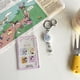 thumbnail image 5 of Llavero con funda de acrílico transparente antipérdida con diseño de Snoopy, Charlie Brown y Peanuts de Kawaii, portatarjetas de identificación, bolsa con colgante, regalo para niñas, 5 of 5