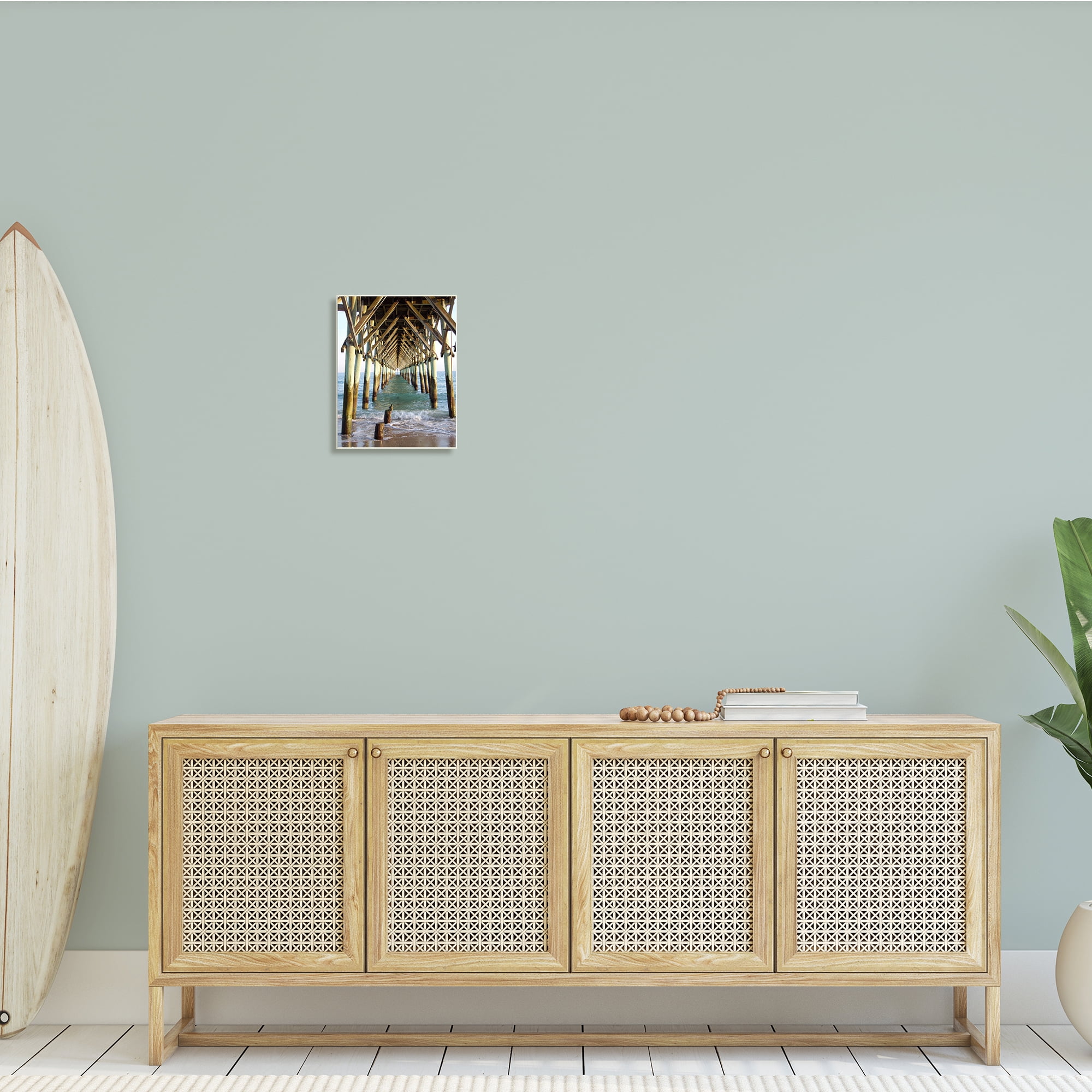 Weathered Beach Pilons Ocean Waves Under Tall Dock 10 in x 15 in Framed Photography Photographic Wall Art, by Stupell Home Décor