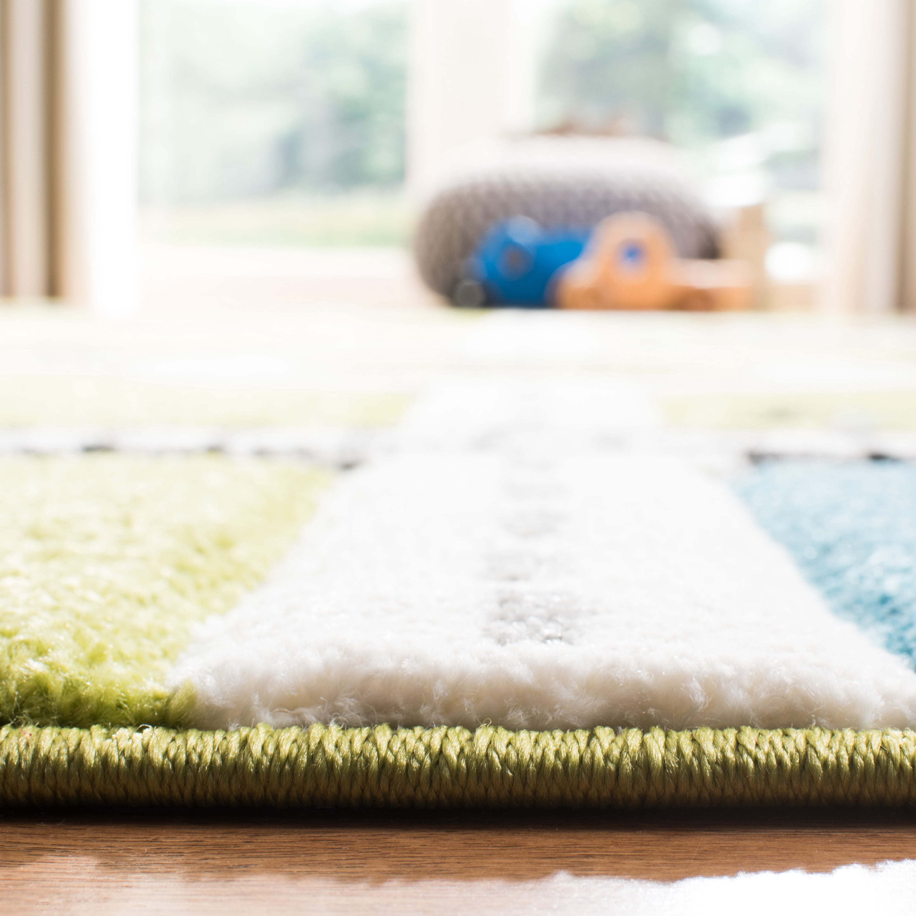 SAFAVIEH Carousel Kids Devan Train Track Area Rug, Green/Ivory, 5'3" x 7'6"