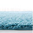 thumbnail image 4 of SAFAVIEH August Shag Collection AUG900K Solid Non-Shedding Living Room Bedroom Dining Room Entryway Plush 1.2-inch Thick Area Rug, 6'7" x 6'7" Round, Turquoise, 4 of 4