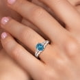 thumbnail image 4 of Gem Stone King 925 Sterling Silver London Blue Topaz and White Lab Grown Diamond 3 Stone Engagement Ring for Women | 1.58 Cttw | Oval 8X6MM | Round 2MM | Gemstone November Birthstone | Size 8, 4 of 6