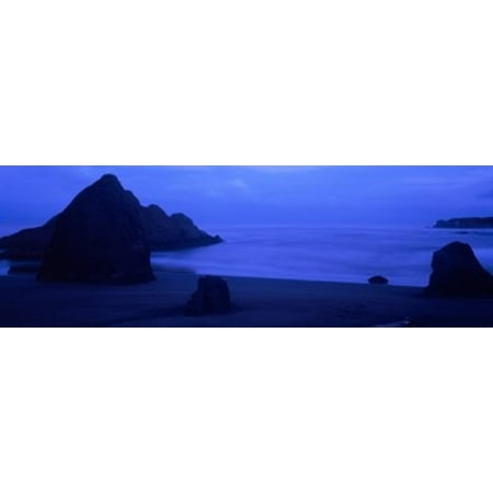 Silhouette of rock formations in the sea Myers Creek Beach Oregon USA Canvas Art - Panoramic Images (18 x