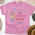 thumbnail image 1 of T-Shirt Graphique « Nursing is a Work of Hearts » pour Femmes, Azalée, Taille g, 1 of 6