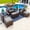 Sunbrella Canvas Charcoal, variant on Tuscany 6-Piece M Resin Wicker Outdoor Patio Furniture Lounge Sofa Set in Brown w/ Loveseat, Two Armchairs, Two Ottomans, and Coffee Table (Half-Round Brown Wicker, Polyester Light Gray)