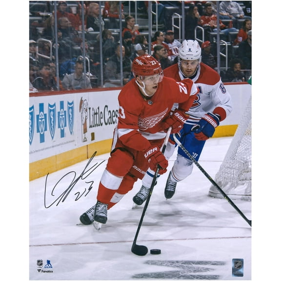 Lucas Raymond Detroit Red Wings Autographed 16" x 20" Red Jersey with Puck Photograph - Fanatics Authentic Certified