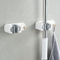 thumbnail image 1 of Soporte de Pared para Trapeador | Gancho Resistente para Baño | Instalación Sin Taladros | Colgador de Trapeador de Plástico para Organizar La Cocina y El Baño | Blanco o Gris, 1 of 6