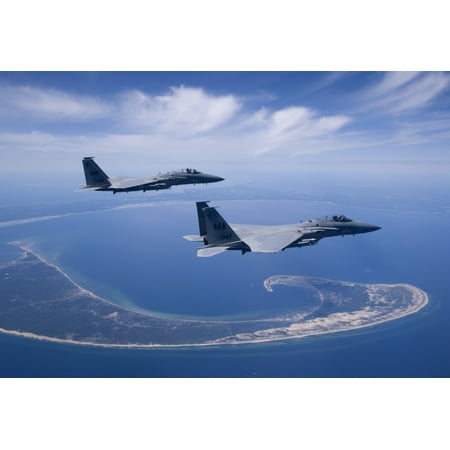 Two F-15 Eagles from the Massachusetts Air National Guard fly high over Cape Cod during a training mission Poster