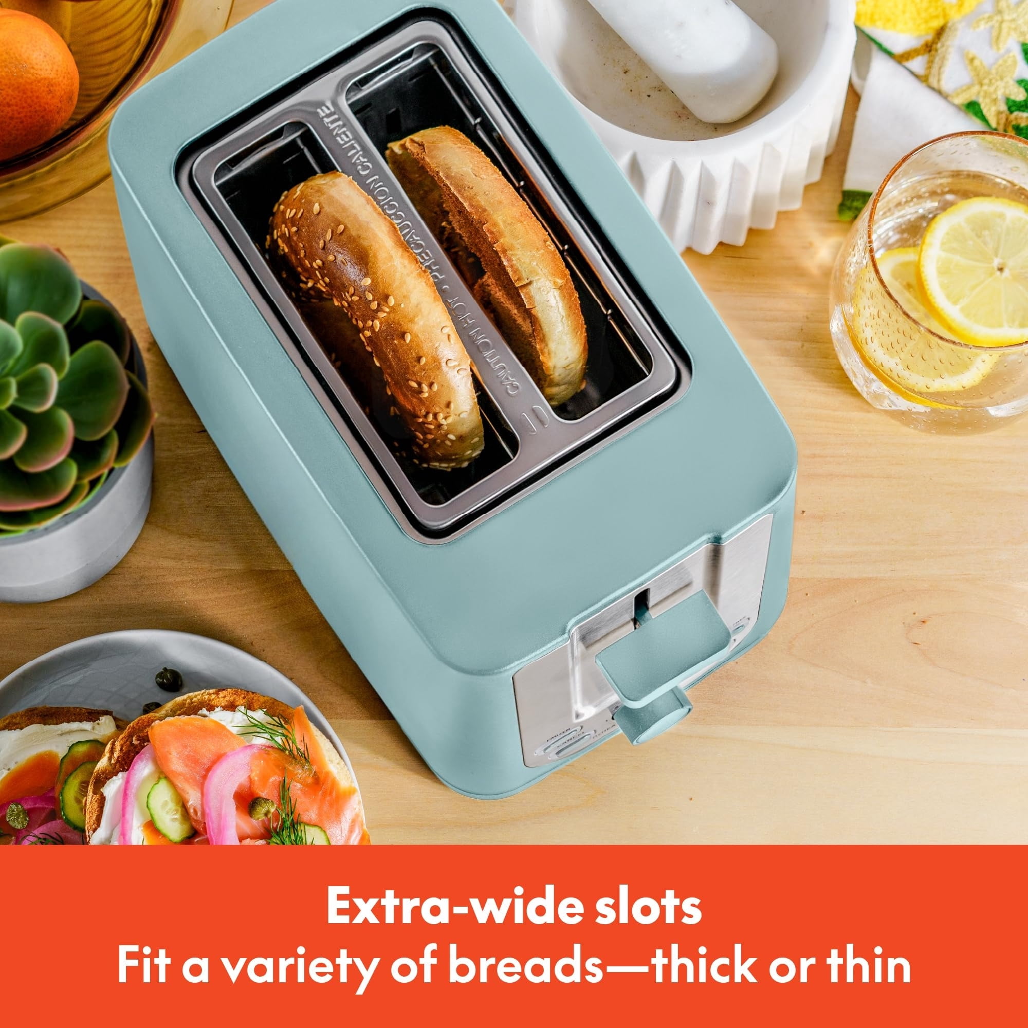 Double-slot toaster with automatic shut-off - extra-wide slots, removable crumb tray, and cancel, defrost, and reheat functions - can toss bread, bagels, and waffles.