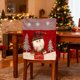 thumbnail image 1 of Funda de silla navideña con dibujos animados | Diseño 3D de Papá Noel, muñeco de nieve y alces | Funda de tela roja para silla de comedor | Decoración navideña para el hogar de 54 x 46 cm, 1 of 5