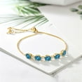 thumbnail image 4 of Gem Stone King 18K Yellow Gold Plated Silver London Blue Topaz and White Topaz Tennis Bracelet for Women (7.84 Cttw, Gemstone Birthstone, Fully Adjustable up to 9 inch), 4 of 5