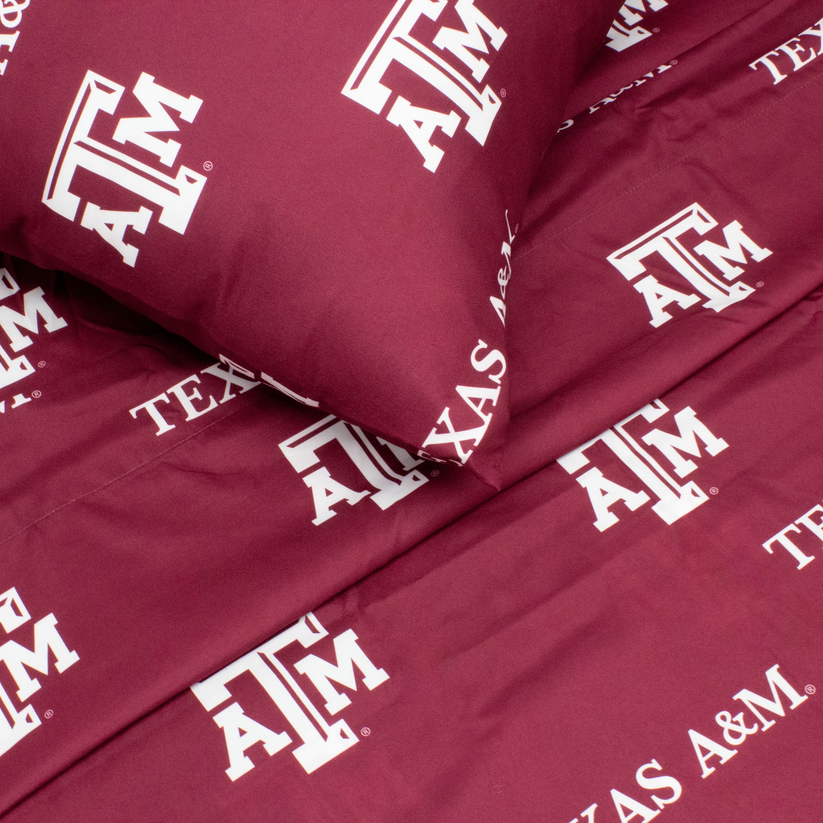 Texas A&M Aggies Twin Sized 3 Piece Sheet Set, Team Color Background, 1 Flat Sheet, 1 Fitted Sheet, 1 Pillowcase