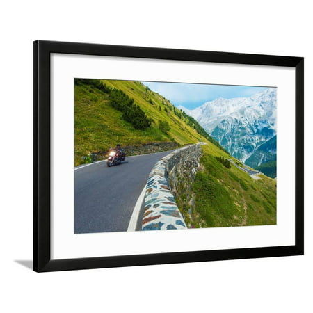 Alpine Road Biker. Motorcycle on the Stelvio Pass, Italy, Europe. Scenic Italian Mountains Road. Framed Print Wall Art By
