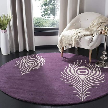 SAFAVIEH Soho Collection 4  Round Purple / Ivory SOH704A Handmade Premium Wool & Viscose Area Rug The Safavieh Soho Collection is modern chic mixed with classic elegance. These clean  contemporary designs are modernized to work equally well in both modern and traditional homes. Each rug is handmade of the purest  premium New Zealand Wool  to add clarity and softness. These rugs are accented with viscose  to add silky softness to the wool. This innovative collection is handmade in India.