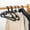 Black, variant on Djiypn 10 Pack Plastic Clothes Hangers - Slim Plastic Clothes Hangers with Clips for Skirts, Pants, Shirts, Space Saving Clothes Hangers for Closet, Black