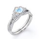 thumbnail image 4 of JeenMata Anillo de Bodas con Banda Trenzada Infinita de Moissanita y Piedra Lunar Azul de Talla Redonda de 1,75 Quilates con Bisel de Halo de Flores Engastado en Oro Blanco de 18 K sobre Plata, 4 of 6