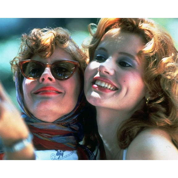 Thelma and Louise Susan Sarandon & Gina Davis hug for close-up 8x10 inch photo