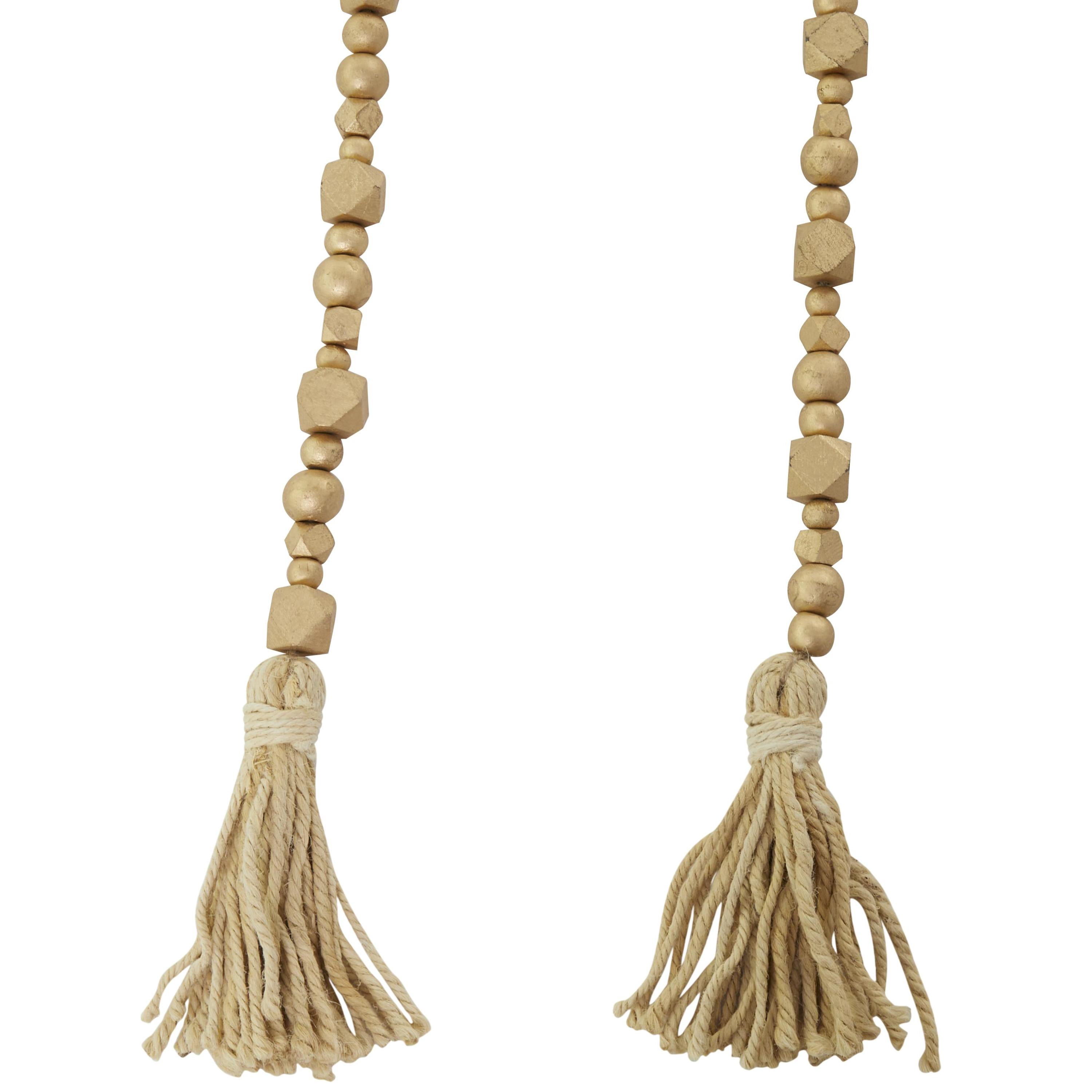 DecMode Handmade Hexagon Metallic Carved Geometric Long Gold Mango Wood Garland with Tassel