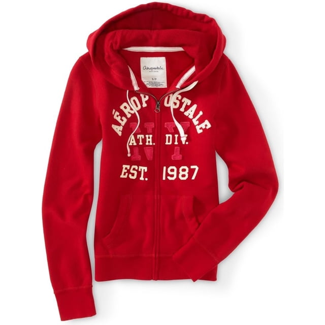 aeropostale sudadera con capucha y cremallera completa para mujer, rojo, mediano aeropostale sudadera vista frontal boca arriba de una sudadera roja con cremallera completa y capucha, cordones blancos, letras pequeñas bordadas en el pecho con 'Aéropostale' y 'EST. 1987', bolsillos tipo canguro dobles, mangas largas con puños acanalados; prenda informal ideal para capas y uso diario.