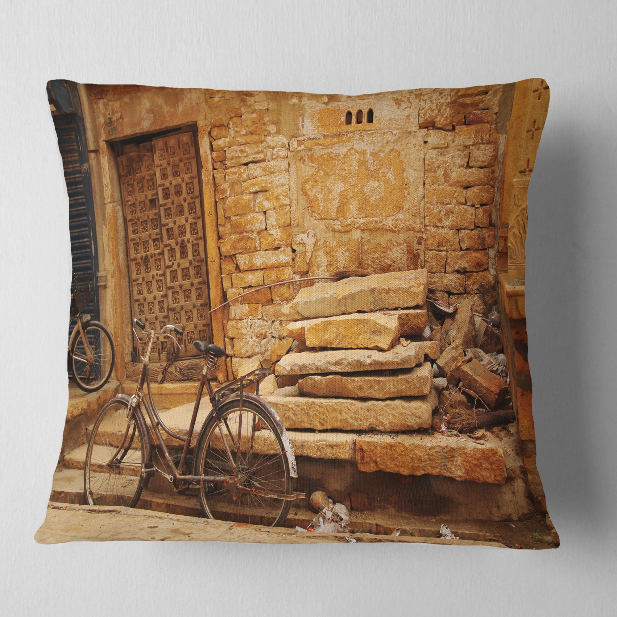 Designart Bicycle against Brown Wall - Landscape Photo Throw Pillow - 16x16