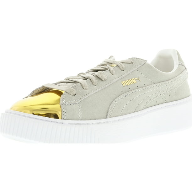 white and gold pumas with strap