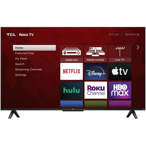 pantalla tcl 55" class 4 serie 4kuhd smart roku (55s455) televisor 55" negro con interfaz de inicio Roku visible, mosaico de canales como Netflix, Disney+, Apple TV, Hulu y Roku Channel, iconos de caja de cable y consola de juegos, patas en V y marco delgado.