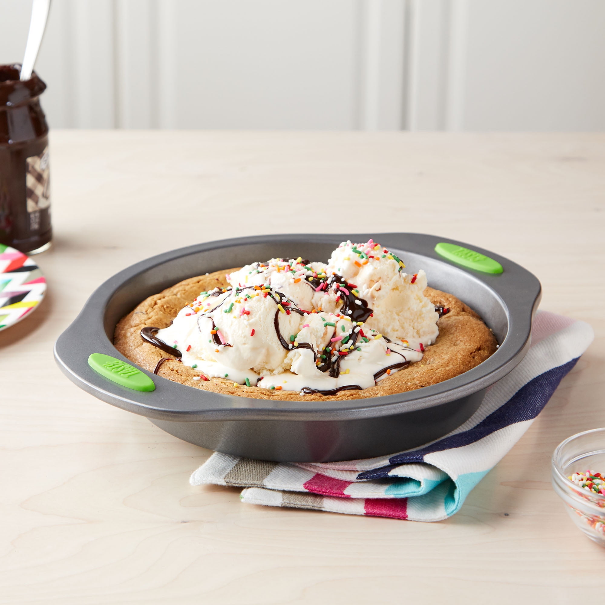 Tasty 9" Round Cake Pan with Green Silicone Handles